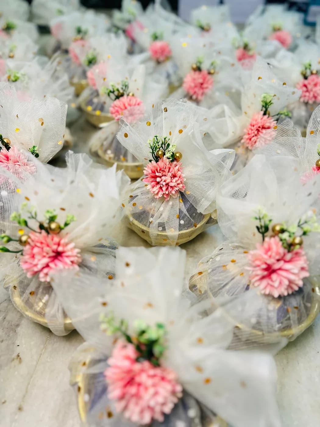 Net wrapping and flower brooches, finished by hand